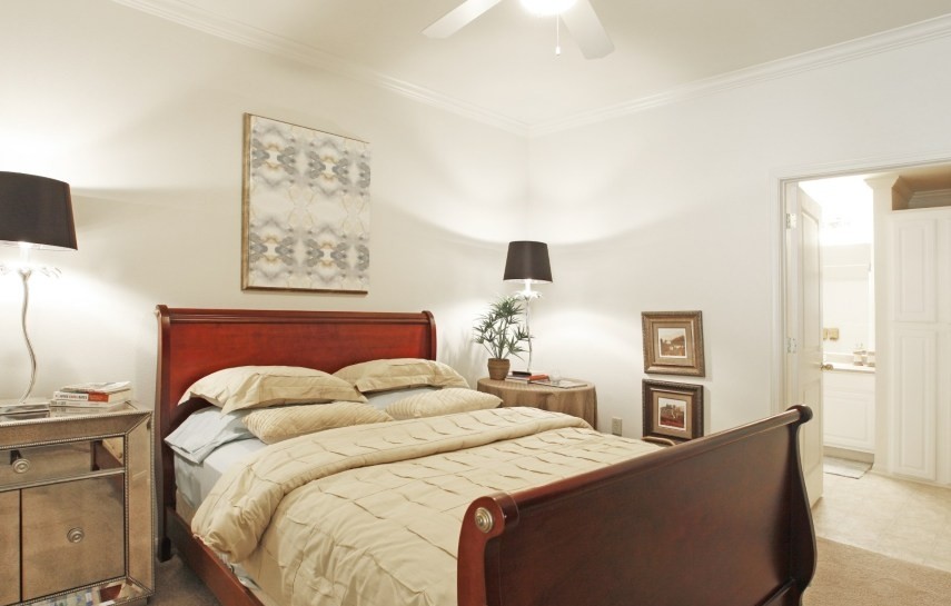 Spacious master bedroom with ceiling fan