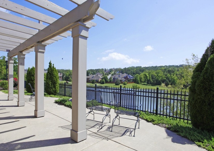 Pergola with scenic lake and neighborhood views